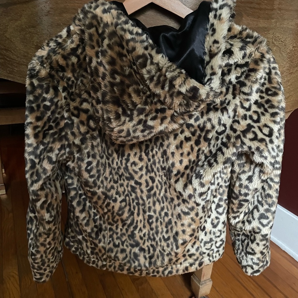 Faux fur reversible 3 button jacket with hood. Black is satin material.